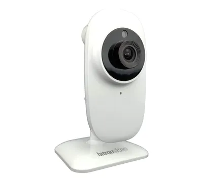 A white indoor camera with a black lens is shown against a white background.