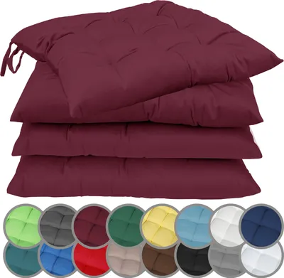A stack of four burgundy seat cushions with ties, shown from a slightly elevated angle. Below the cushions, a row of circular swatches displays various color options for the cushions.