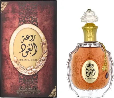 A perfume bottle and its packaging are displayed side-by-side against a white background.