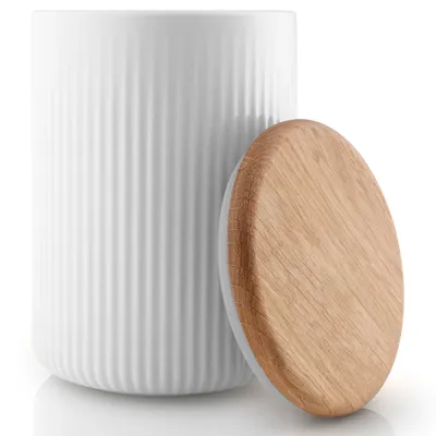 A white ceramic storage container with a ribbed texture and a light brown wooden lid, shown on a white background.