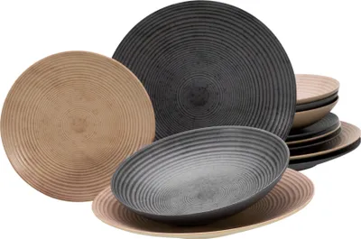 A collection of plates and bowls with a concentric ring design.