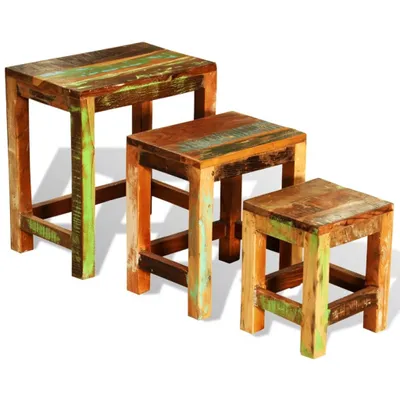 Three wooden stools of varying heights arranged in a stepped formation against a white background.