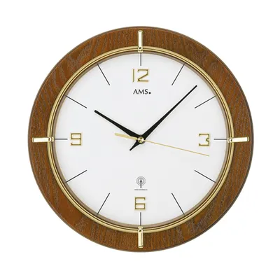 A round wall clock with a wooden frame and a white face.