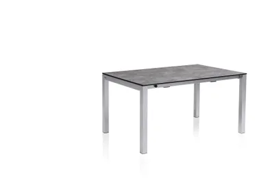 A rectangular outdoor dining table with a grey patterned tabletop and silver legs, presented on a white background.