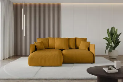 A mustard yellow sectional sofa is shown in a modern living room with a slatted accent wall, sheer curtains, and a potted plant.