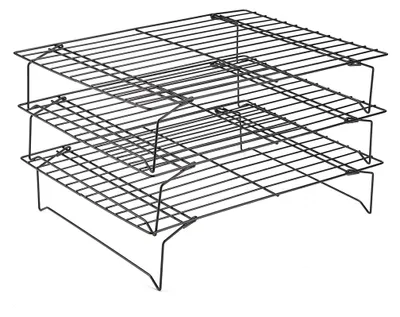 A stack of three black wire cooling racks.