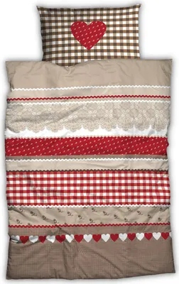 A folded duvet cover and pillowcase set with a country-style design.