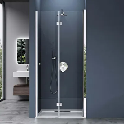 A modern bathroom with a glass shower enclosure.