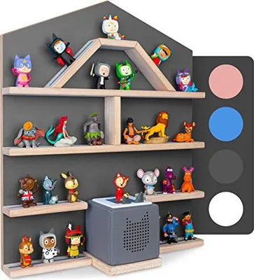 A display shelf filled with various small figurines and a grey audio device, arranged on shelves against a dark grey background.