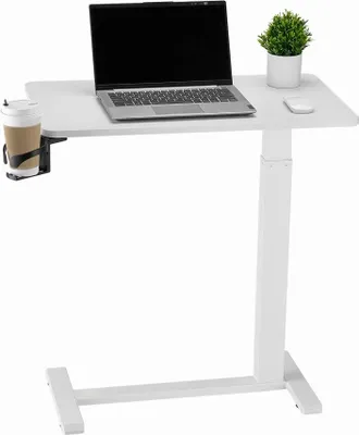 A white adjustable height desk with a laptop, a plant, a mouse, and a cup holder with a cup.