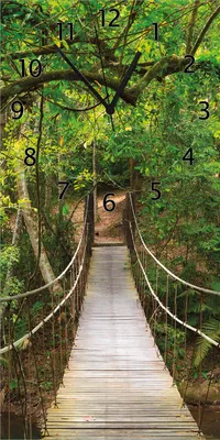 Produktbild von Wallario Design Wanduhr bedruckt, Größe 30 x 60 cm, Motiv: Hängebrücke im Urwald  grüner Dschungel