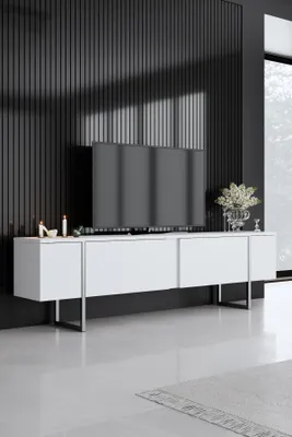 A modern living room with a white TV stand and a large television.