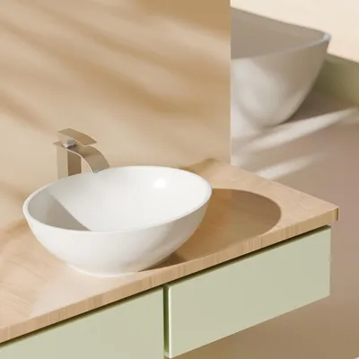 A close-up view of a modern bathroom sink and vanity.