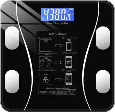 A black digital scale with instructions on how to use it with a smartphone app.