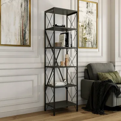 A tall, anthracite-colored bookshelf filled with books and decorative items, placed in a living room setting next to a sofa.