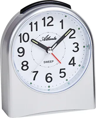 A silver analog alarm clock with a white face and black numbers.