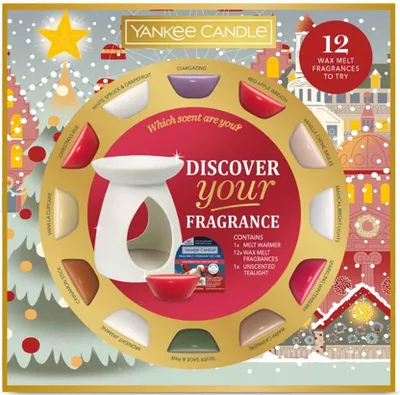 A holiday-themed box set of Yankee Candle wax melts and a warmer, presented in a circular display with various scents labeled around the edge.