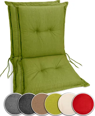 A stack of green chair cushions shown against a white background.