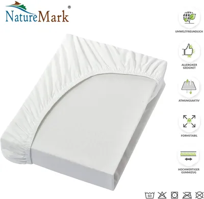 A white fitted sheet is shown on a mattress, with a logo and feature icons on the right side.