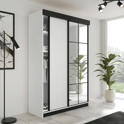 A modern wardrobe with sliding doors and mirrored panels in a well-lit room with plants.