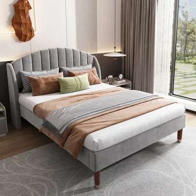 A bedroom setting with a bed as the main focus.
