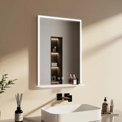 A modern bathroom vanity area with a sink, faucet, and a lit mirror.