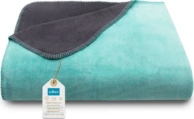 A folded blanket with a tag attached.