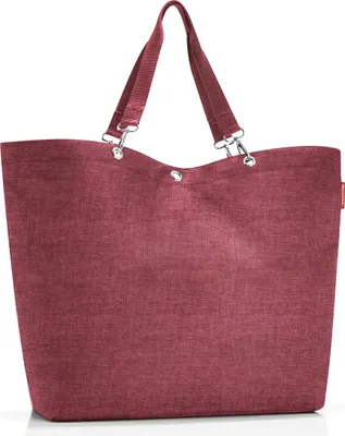 A studio shot of a maroon tote bag.