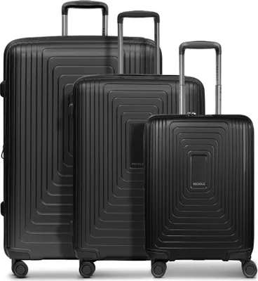 A set of four black suitcases of varying sizes arranged in a row.