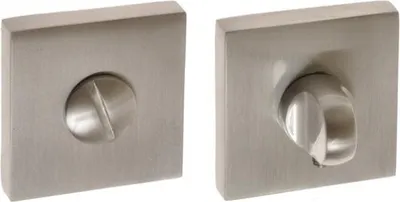 Two square metal plates with a circular knob on one and a screw on the other, likely part of a door handle mechanism.