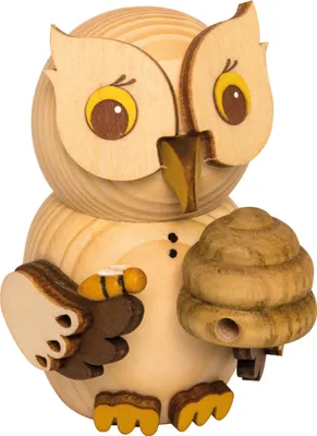 A wooden owl figurine holding a beehive and a bee.