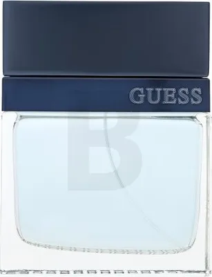 A close-up shot of a Guess Seductive Homme Blue eau de Toilette bottle.