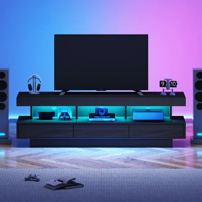 Immagine prodotto di Mobile TV a basso con finitura nera lucida, dimensioni 160 x 38 x 50,5 cm, realizzata al 100% in pannelli di truciolato, con illuminazione LED controllabile tramite app, adatta per televisori fino a 70 pollici