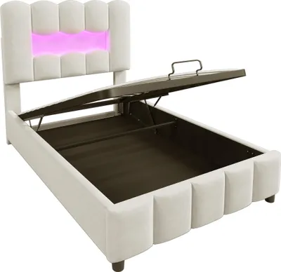 A beige upholstered bed frame with the storage lid open, revealing the storage compartment. The headboard has integrated pink LED lighting.