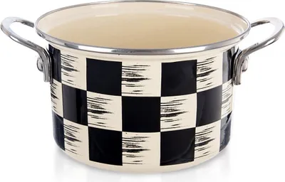 A close-up studio shot of a black and white checkered enamel pot.
