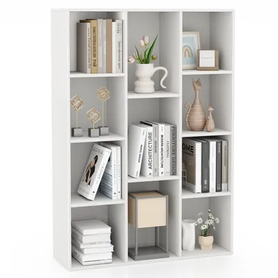 A white, multi-compartment bookshelf filled with books and decorative items, presented against a white background.
