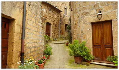 Produktbild von Wallario Herdabdeckplatte aus Glas, Größe 90 x 52 cm 3-teilig, Motiv Weg durch die Altstadt - Toskana in Italien