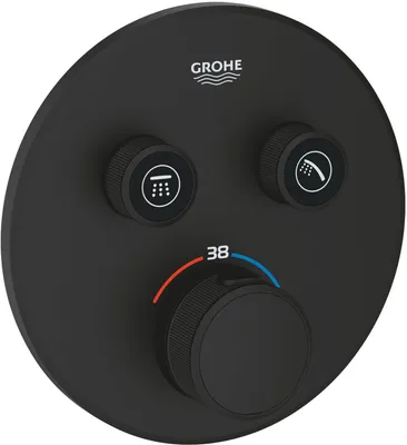 A black thermostat control panel with three knobs and temperature markings.