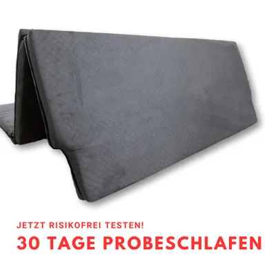 A folded gray mattress is shown against a white background with promotional text below.