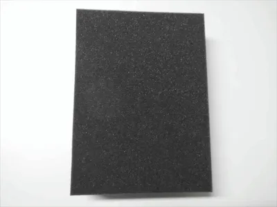 A single piece of black foam padding is shown against a white background.