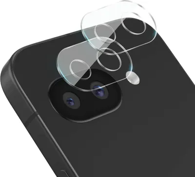 A close-up shot of a smartphone's camera lens area with protective glass covers being applied.