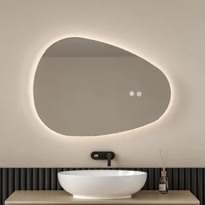 A modern bathroom vanity with a sink, faucet, and an illuminated mirror.