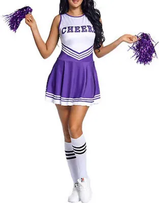 A woman is posing in a cheerleader costume.