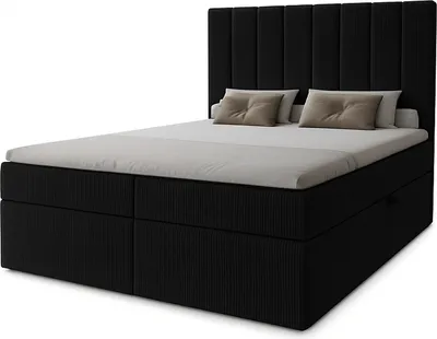 A black boxspring bed with two pillows on a white background.