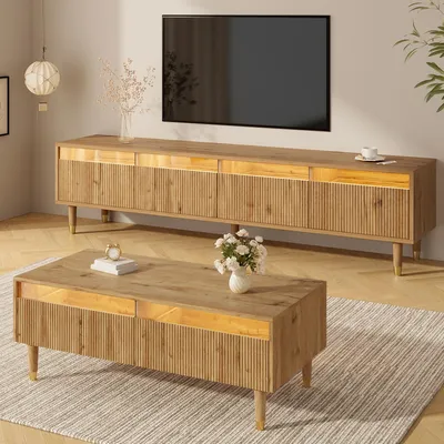 A living room scene featuring a TV stand and coffee table set.