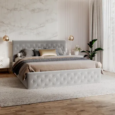 A bedroom scene with a large upholstered bed as the main focus.