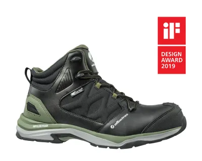 A black and green work boot is shown against a white background, with an award logo in the upper right corner.