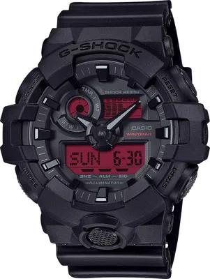 A close-up, front-facing studio shot of a black G-Shock digital watch with a red display.