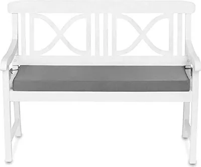 A white garden bench with a gray cushion.