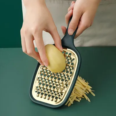 Produktbild von Edelstahl-Gemüsereibe und praktischer Kartoffelschneider für die Küche